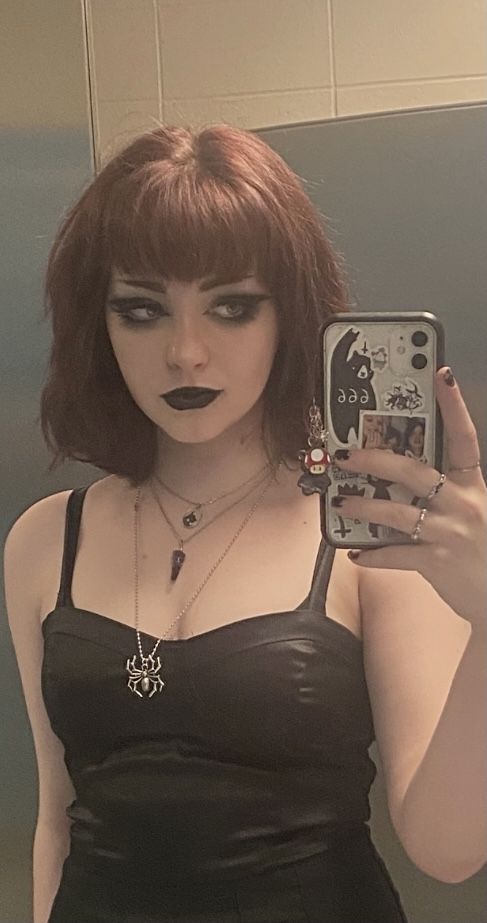1girl, female only, white female, medium hair, brown hair, makeup, selfie, fringe, pale skin, non-nude, light skin, black clothes, clothed, pale, necklace, mirror selfie, goth, black lipstick, alt girl, dress, lipstick