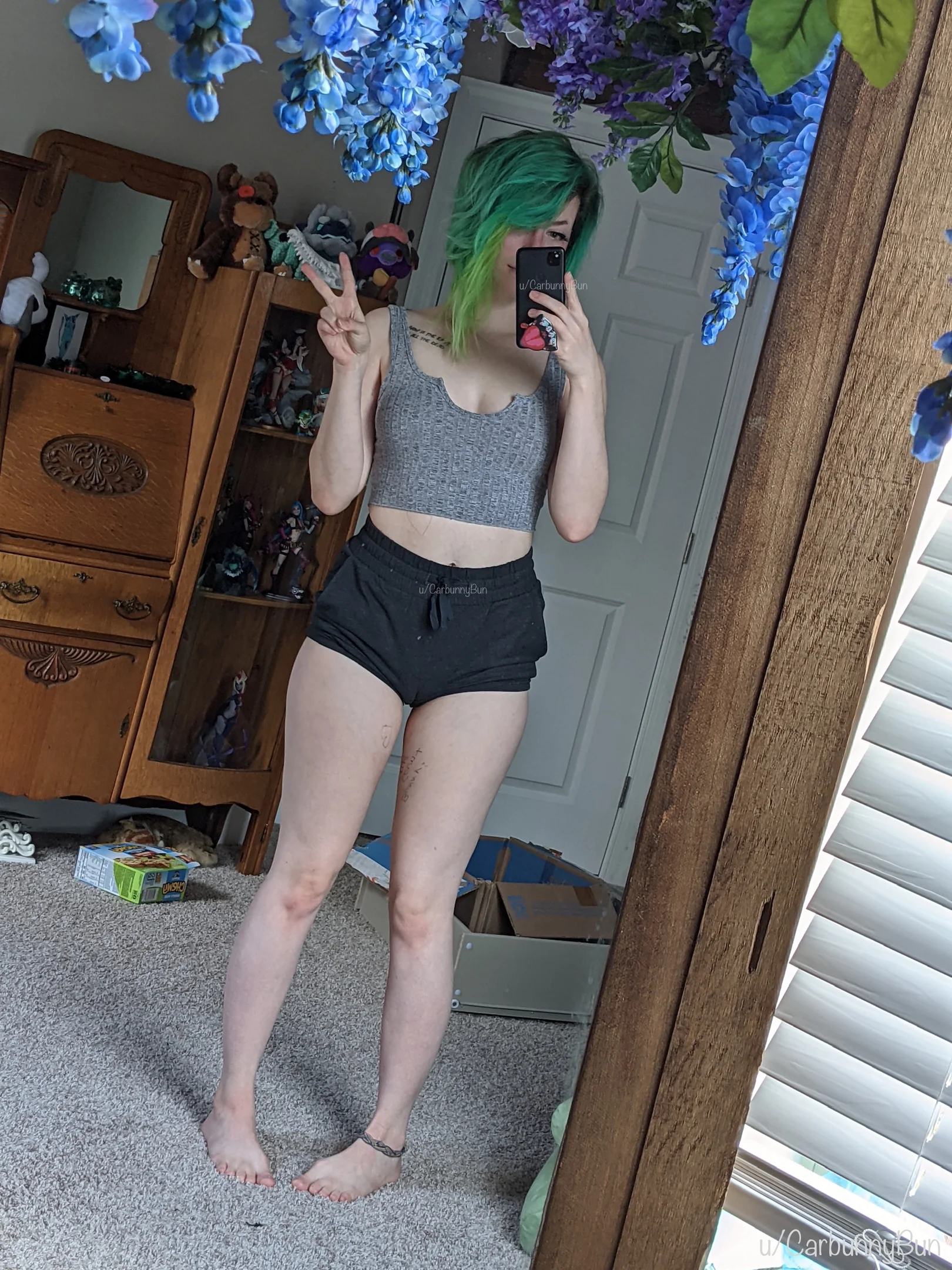 carbunnybun, 1girl, female only, white female, female, pale-skinned female, selfie, bangs, dyed hair, non-nude, tattoo, mirror selfie, pale skin, barefoot, highres, multicolored hair, shorts, midriff, female solo, green hair, cameltoe, body writing