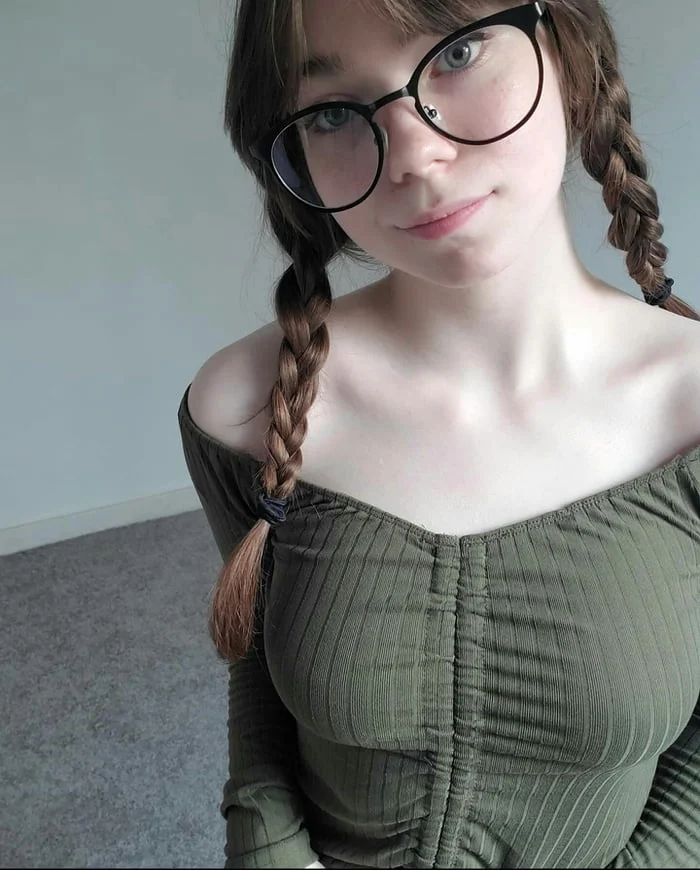classic cassi, sassy cassi, sassycassi, 1girl, female only, white female, looking at viewer, long hair, front view, caucasian female, brown hair, pale-skinned female, smile, fringe, bangs, non-nude, blue eyes, glasses, clothed, long sleeves, teen, braided twintails, braids
