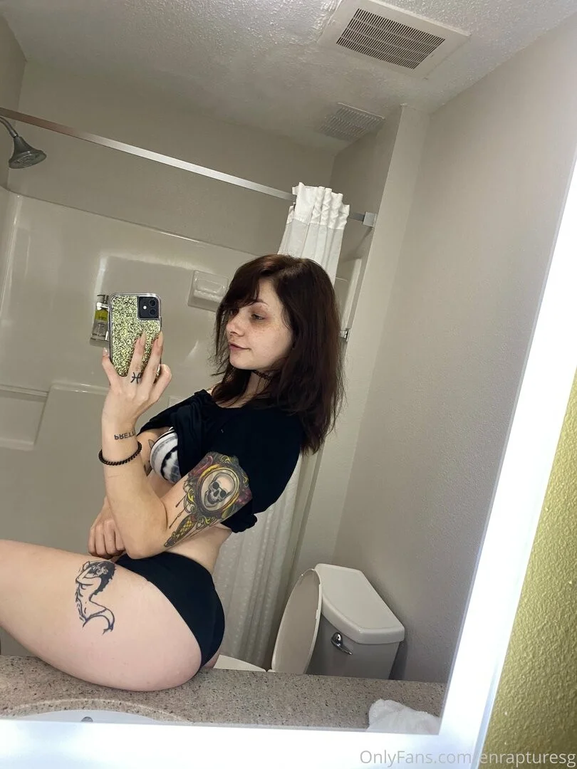 elise tails, enrapturesg, 1girl, female only, white female, caucasian female, light-skinned female, medium hair, ass, brown hair, selfie, piercing, pale-skinned female, panties, tattoos, fringe, bangs, smile, non-nude, nose piercing, black clothes, clothed, mirror selfie, onlyfans, bra, shirt up, bathroom, choker, freckles, black panties, alt girl, side view, septum piercing, short sleeves, emo, black choker