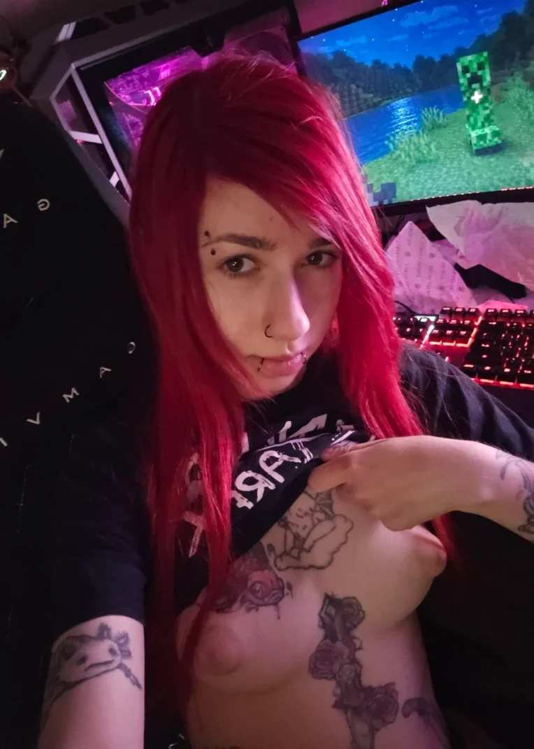 okquaint, 1girl, female only, white female, breasts, nipples, looking at viewer, light-skinned female, long hair, front view, areolae, caucasian female, navel, pale-skinned female, selfie, stomach, piercing, sitting, small breasts, reddit, tattoos, fringe, bangs, dyed hair, nose piercing, no bra, red hair, navel piercing, shirt up, slim body, light areolae, shirt lift, goth girl, short sleeves, teen, european female, lip piercing, alt girl, on chair, puffy nipples, black shirt, polish female, sitting on chair, eyebrow piercing, emo girl, gamer chair, emo, gamer girl